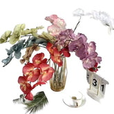 Huitich pack of assorted faux flowers featuring colorful artificial blooms in a clear vase